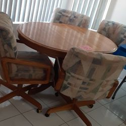 Table With 4 Rolling Chars Excellent Condition