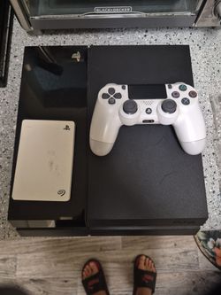 Playstation 4 with External Hard-drive and remote.