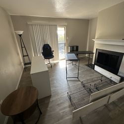 queen bed, bedside tables, lamp, desk and gaming chair