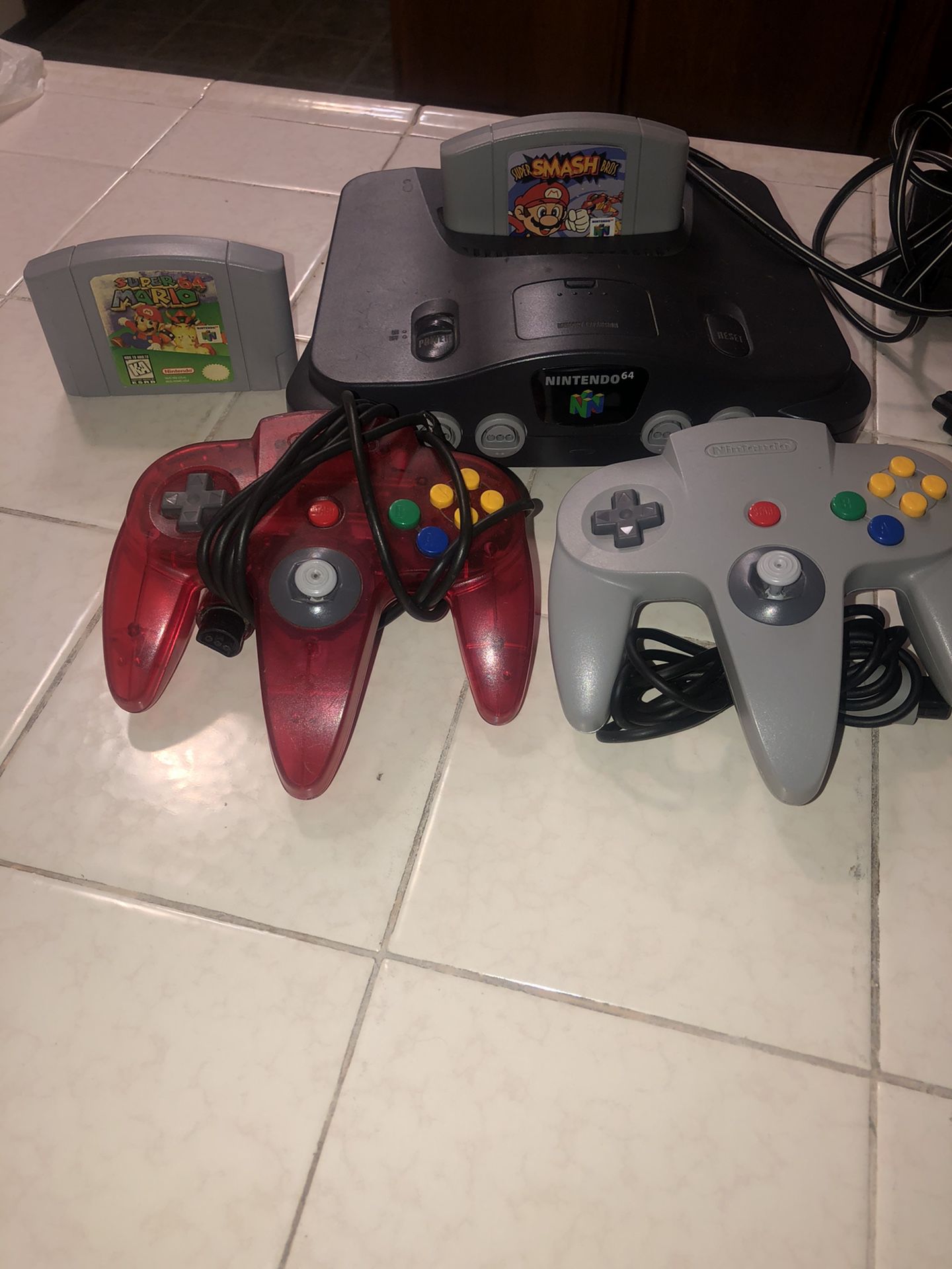 Grey Nintendo 64 + 2 Games including Super Smash Bro’s