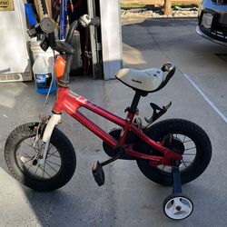 Two bikes one peddle and one strider