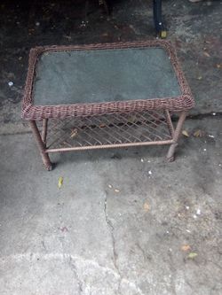 Brown wicker glass top side table