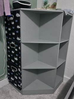 Grey corner shelf with cube shelving