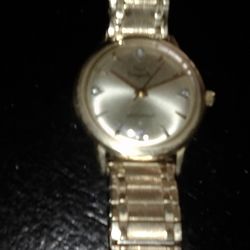 Gold watch ...