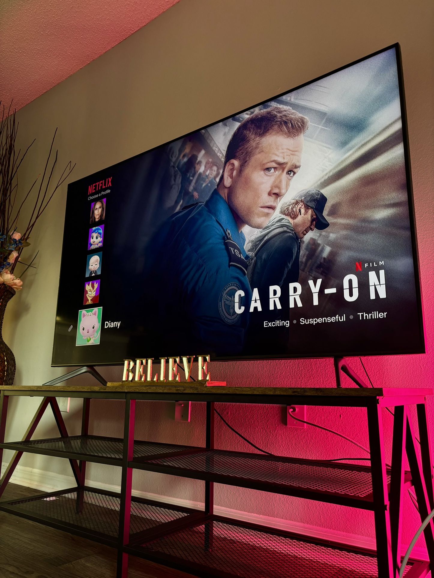 65inch TV, TV Stands & Gold “Believe” Sign
