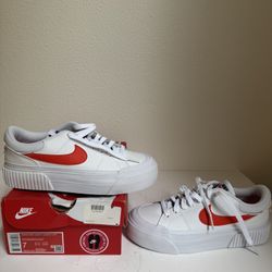 Nike Shoe With Orange Strip And Animal Print