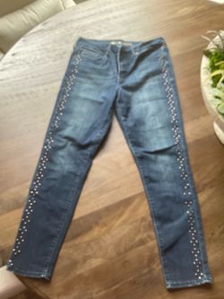 Seven7 studded skinny jeans with silver studs along the outer seams of the legs, size 12