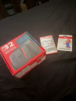 Nintendo switch 2 with game microsd card and joy con wheel
