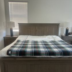 Solid wood king-size bed purchased from Living Space; for sale due to moving.