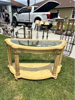 Beige entry table with glass top from Ashley’s in great condition