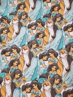 100% cotton Disney print $ 10 1/2 Yard