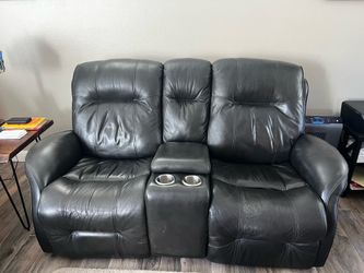 Dark gray leather loveseat