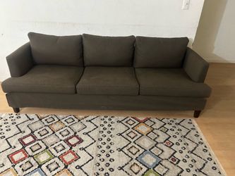 Three seater brown sofa