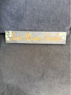 Wood sign wall decor LOVE NEVER FAILS
