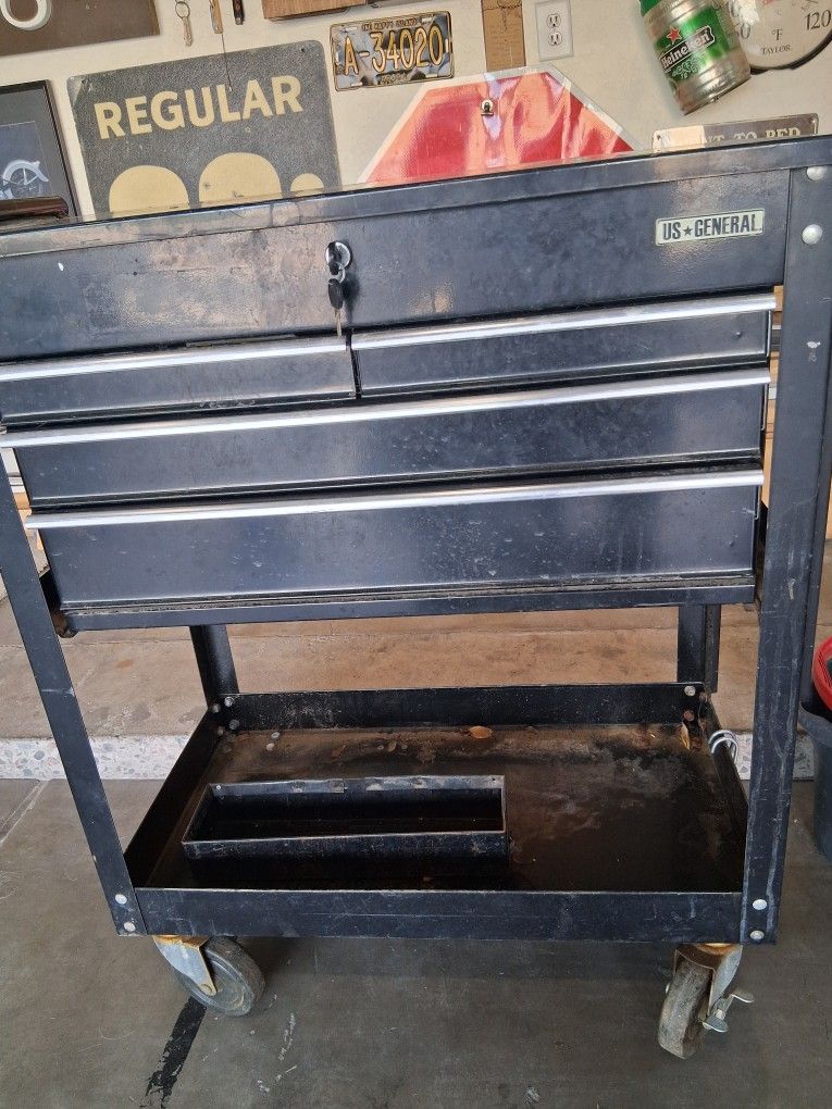 Four drawer rolling mechanics toolbox with tools