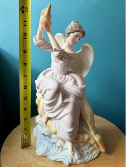 Angel Sitting on Conch Shell Figurine