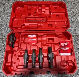 Milwaukee press tool jaw set stored in the original red hard case. Includes multiple jaw sizes seated in molded slots. Case and jaws are in great cond