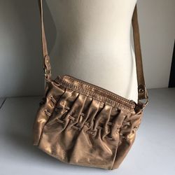 Small golden Michael Kors over shoulder purse