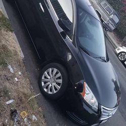 Nissan  2013. Titulo Limpio  con 100mil. Millas. Originales