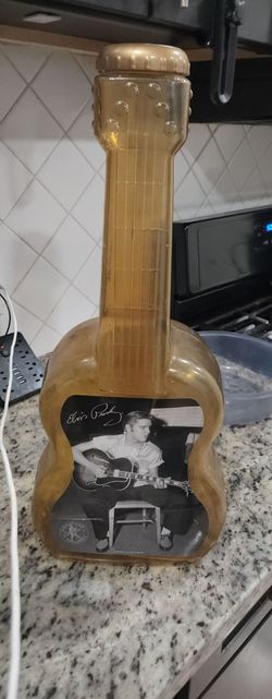 Vintage Elvis Presley plastic guitar coin bank