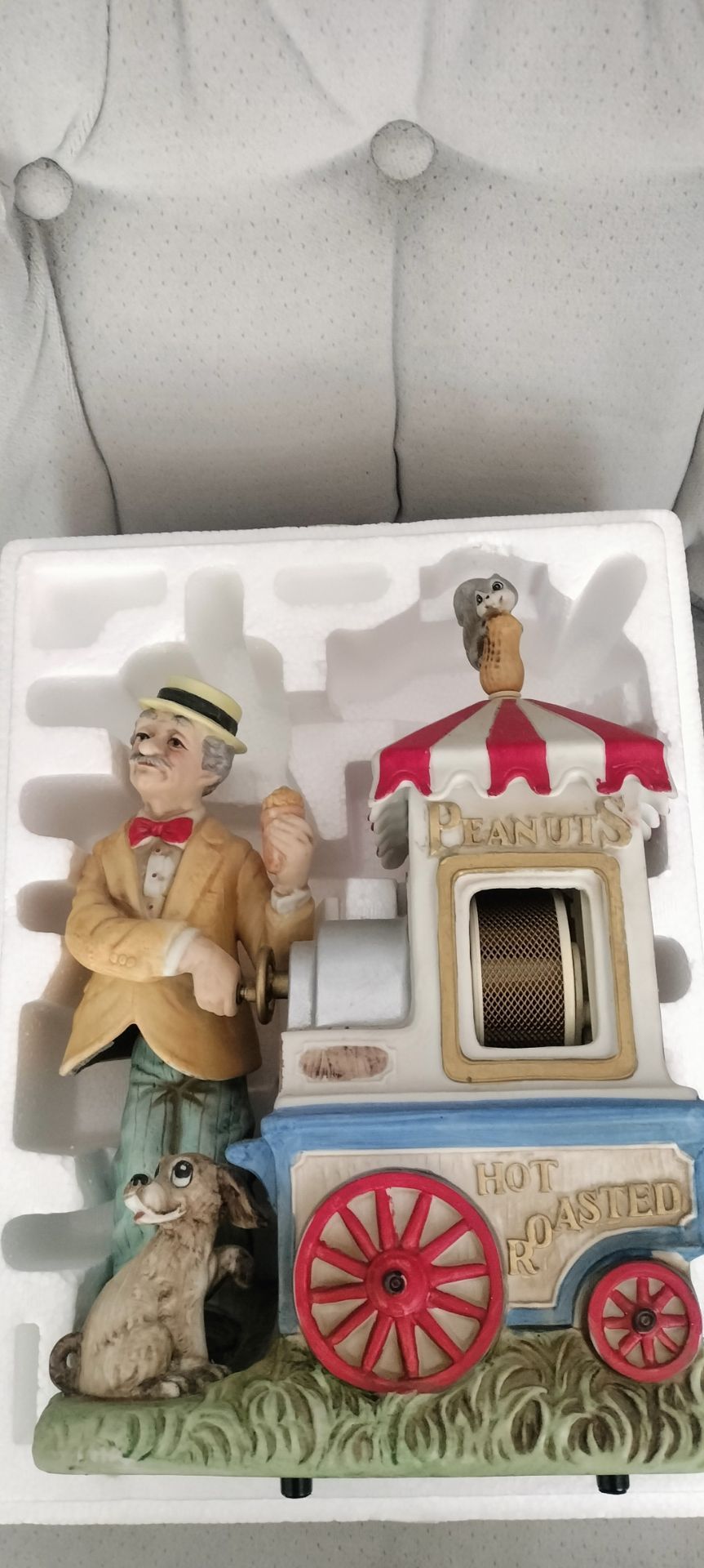 Melody in Motion Peanut Vendor animated music box, a collectible porcelain figurine
