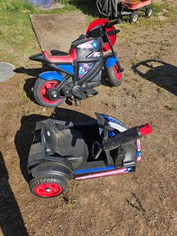 child motorcycle with side car. could ride with or without side car charger included