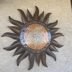 Tiled sun sculpture.