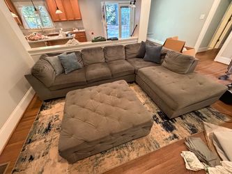 Gray sectional and ottoman