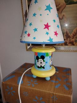Mickey mouse lamp vintage everything works the bottom lights the top light the pictures are very clear and it's a very clean with a lamp shade