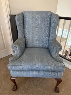 Blue Upholstered Wingback Chair with Carved Legs
