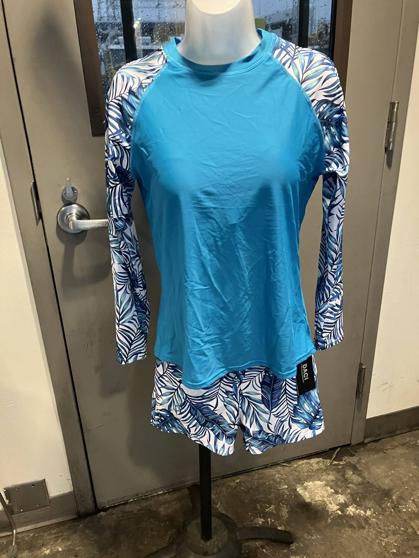 Brand new with tag long sleeve two-piece shorts, swimwear size large
