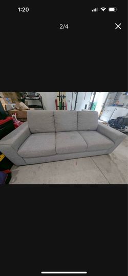 Gray fabric 3-seat sofa from Living Spaces.