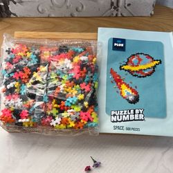 PLUS. P LUS.   500. Puzzles. By.  Number.  SPACE. 
