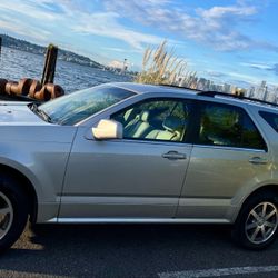 2004 Cadillac SRX V8 with a folding third-row seat for 7 passengers, AWD, 137,000 miles, asking $3,500