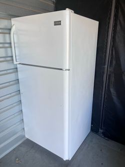White Frigidaire top-freezer refrigerator