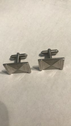 Silver toned cuff links