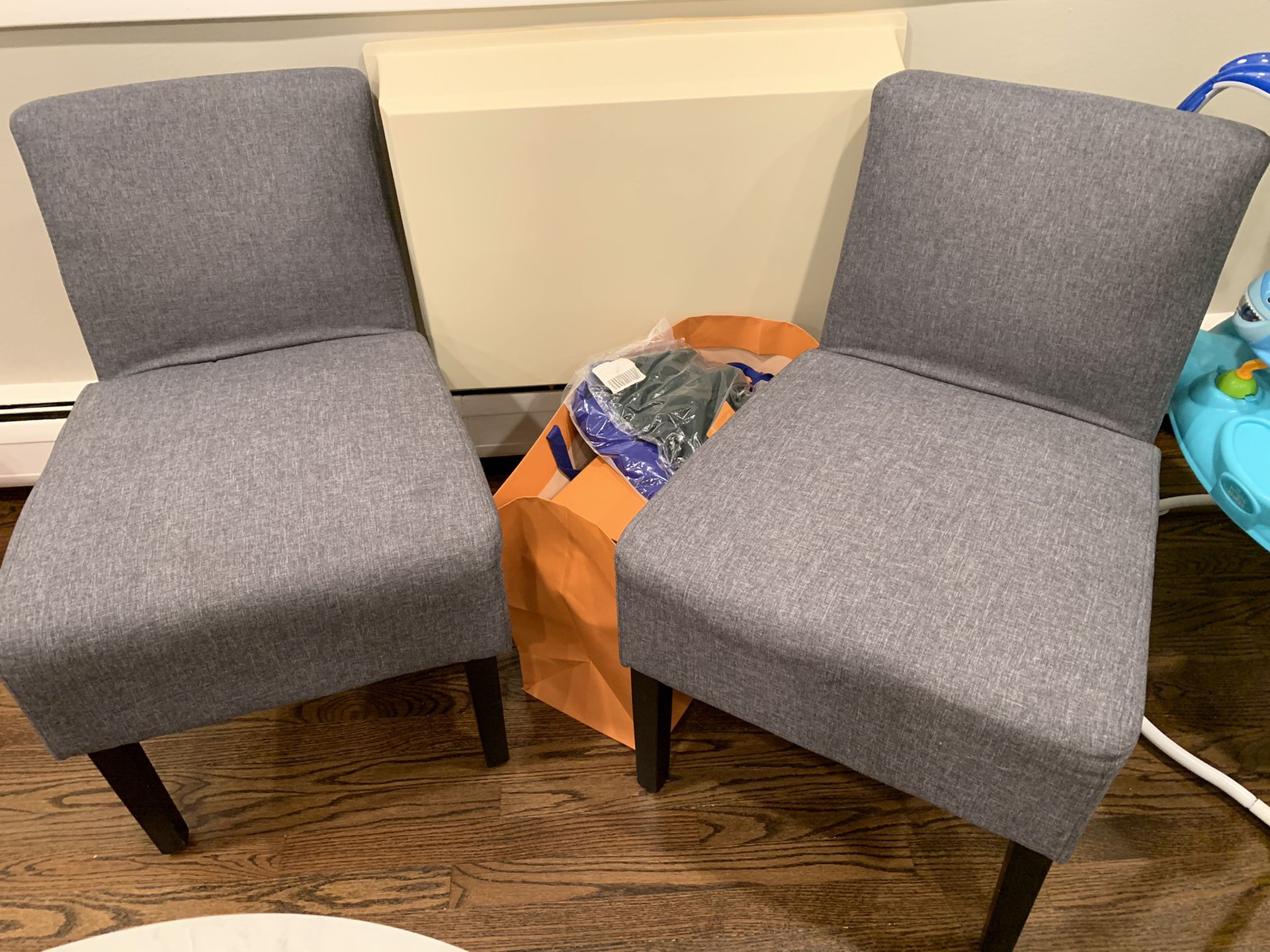 Two gray like new accent chairs