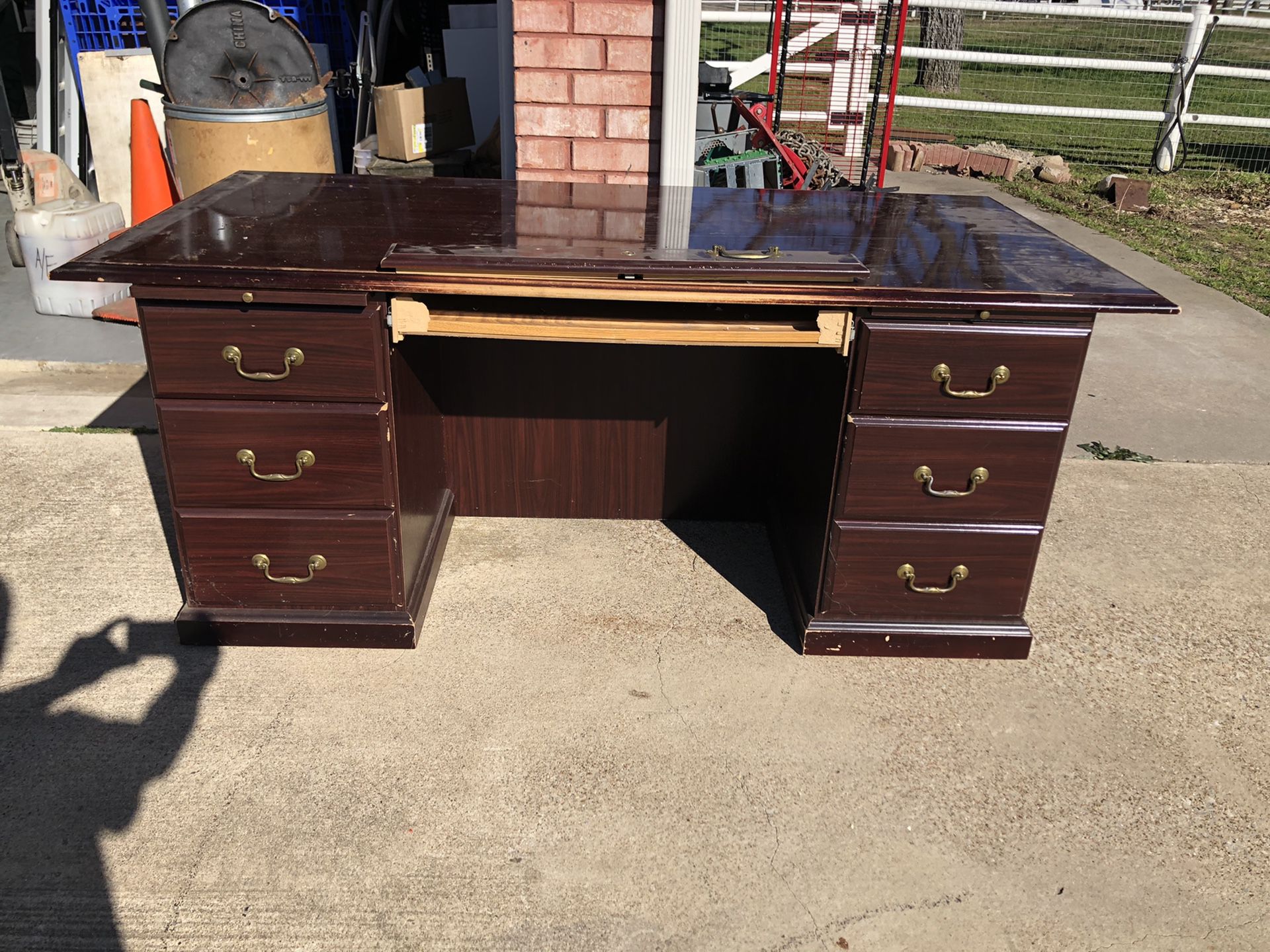 FREE Large office desk very sturdy & heavy. Has a lot of scratches and the center drawer needs to be screwed back in place. Great project piece.