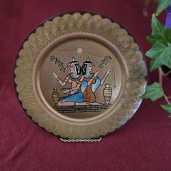 "Legacy of the Nile: Egyptian Sisters Brass Plate – A Timeless Echo of Ancient Beauty"