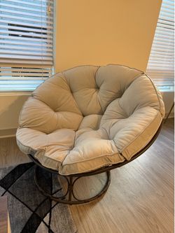 Papasan chair with light gray cushion