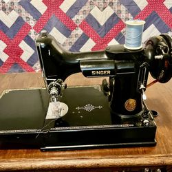 Singer, Featherweight, Sewing Machine & antique Singer sewing machine table over 100 years old.