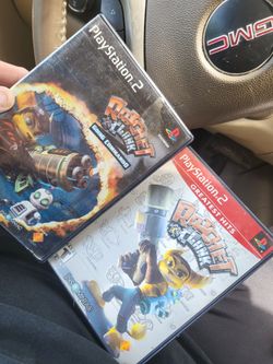 2 playstation, two games, ratcheting clank, and ratchet, and clank going commando