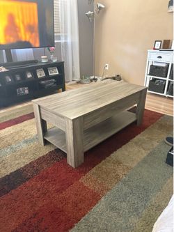 Coffee table with bring up top