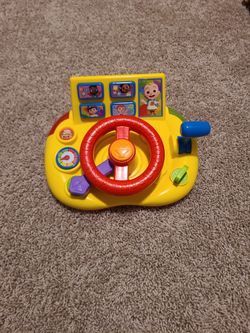 CoComelon Learning Steering Wheel interactive toy.
