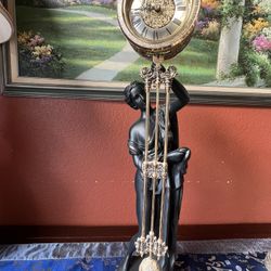pendulum clock with Greek goddess