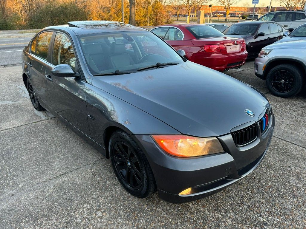 2007 BMW 328i /// 
with Black Rims and red brake calipers - Aftermarket touchscreen HeadUnit -Rearview Camera 

FINANCING AVAILABLE THROUGH LENDERS!
C