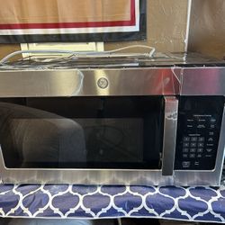 Brand new GE microwave!! Over store