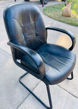 A Boss Office Product Mid Back Leather  Guest Chair