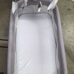 Bassinet With A Donut Pillow And A Wipe Warmer 