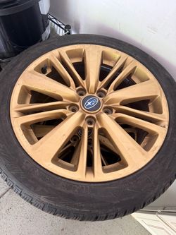 Subaru winter tires with rims and spare tire